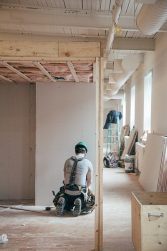 Construction worker working indoors.