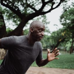 Close up of older man going for a run outside.