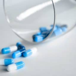 Generic blue and white pill capsules.