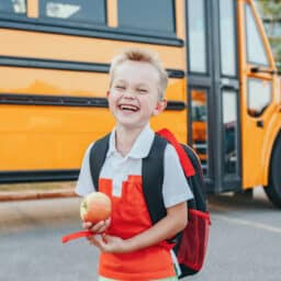 Young boy wears hearing aid
