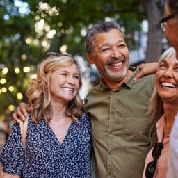 Group of happy friends sharing a moment outdoors.