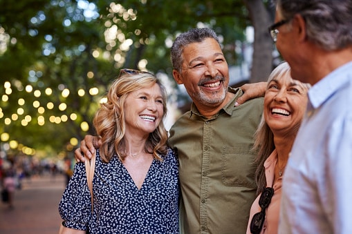 Group of happy friends sharing a moment outdoors.